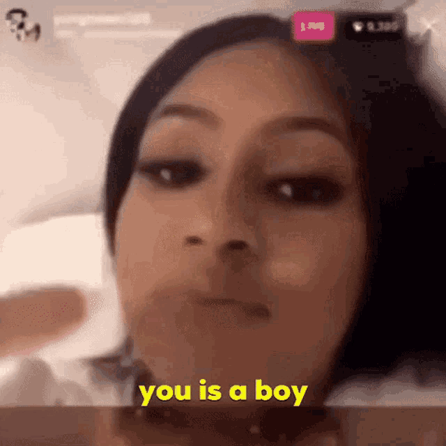 a close up of a woman 's face with the words you is a boy written in yellow