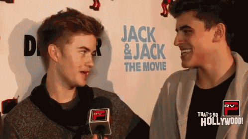 two young men are talking in front of a wall that says jack and jack the movie