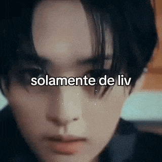 a close up of a person 's face with the words `` solamente de liv '' written in front of it .
