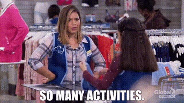 a woman is talking to another woman in a clothing store .