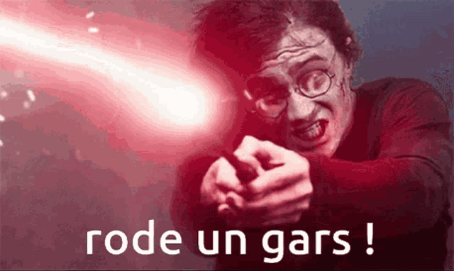 harry potter is pointing at the camera with a red light behind him and the words rode un gars