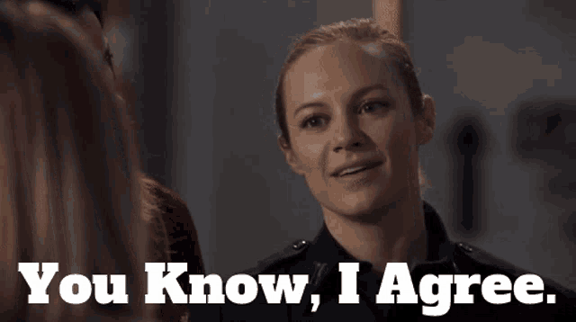 a woman in a police uniform says " you know i agree " to another woman
