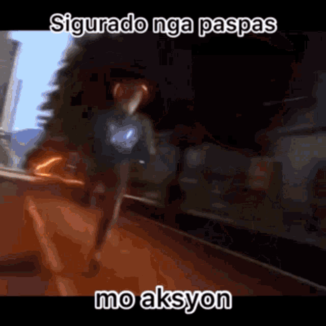 a blurry picture of a person running down a street with the words sigurado nga paspas mo aksyon .