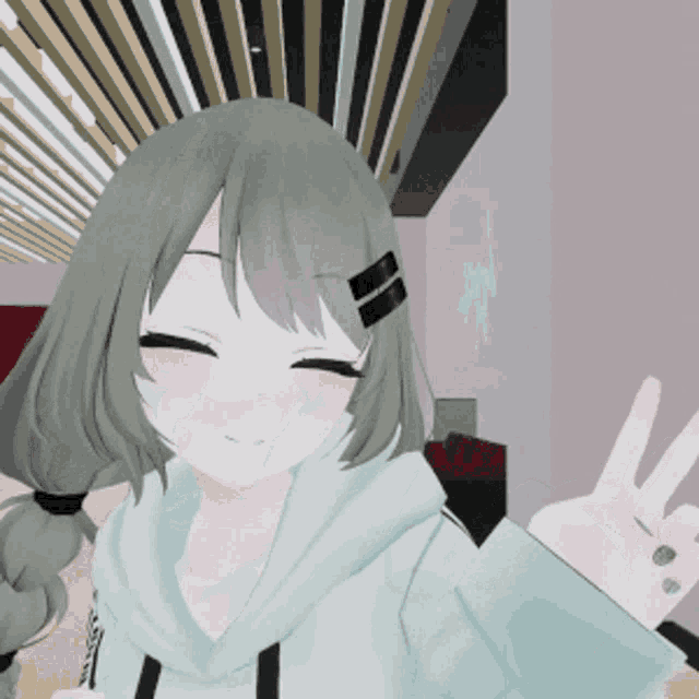 a girl with gray hair and a white hoodie giving a peace sign