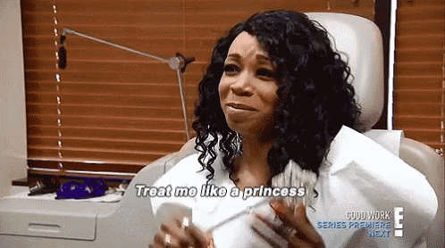 a woman is sitting in a dental chair and talking to a doctor who says treat me like a princess