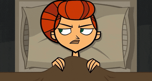 a cartoon character with red hair is laying in a bed