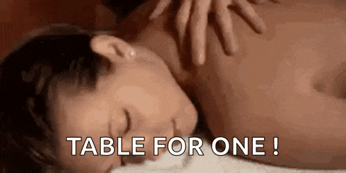 a woman is getting a massage from a man .