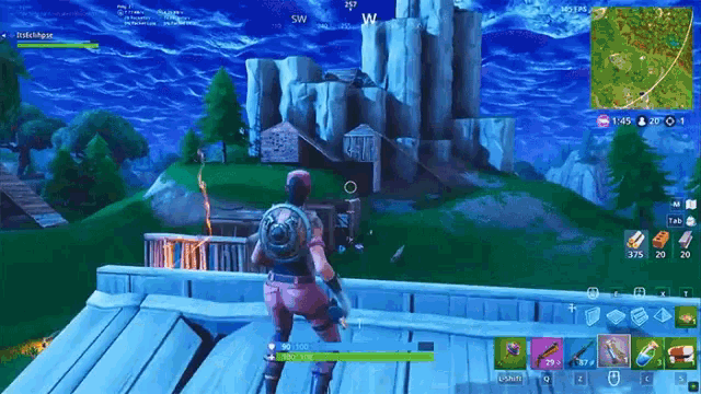 a person is playing a video game called fortnite and they are standing in front of a mountain