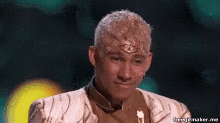 a man with blonde hair and a third eye on his forehead