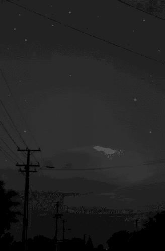 a shooting star is visible in the night sky