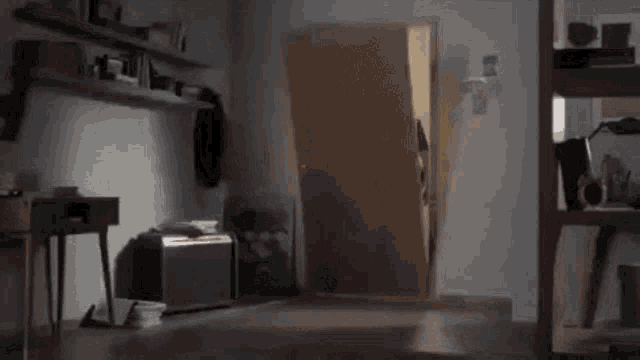 a dog wearing a top hat is coming out of a door