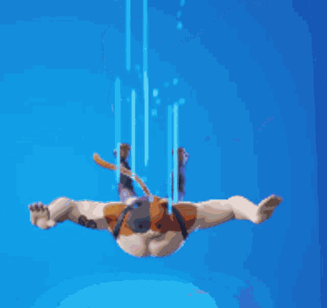 a man with wings on his back is flying in the air