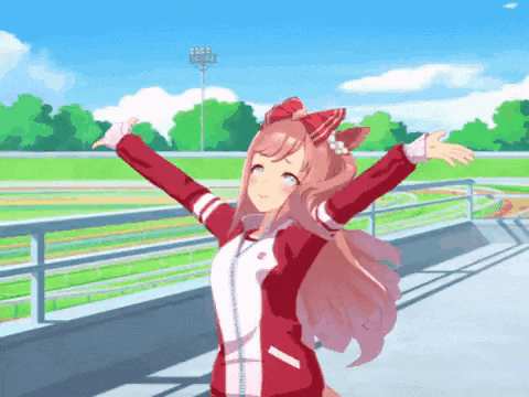 a girl in a red jacket is standing with her arms outstretched in front of a fence .