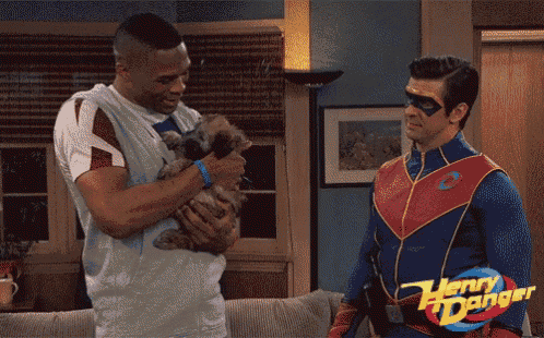 two men in henry danger costumes are holding a cat