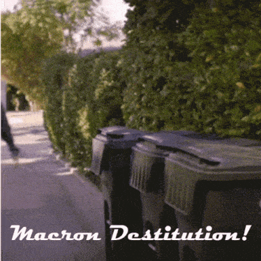 a sign that says macron destitution with a picture of garbage cans