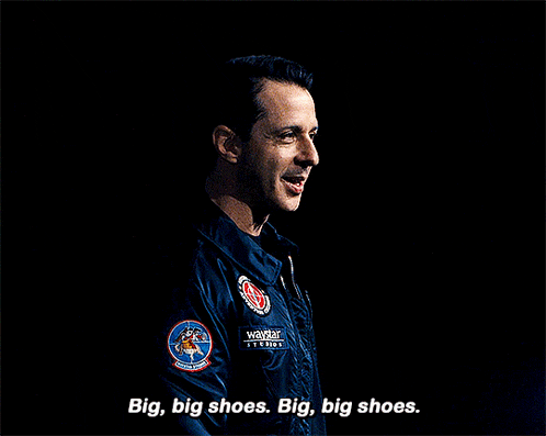 a man in a military uniform is saying big big shoes