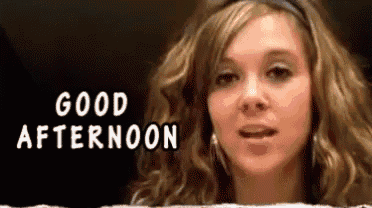 a woman says good afternoon in front of her face