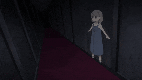 a girl in a blue dress is standing in a hallway