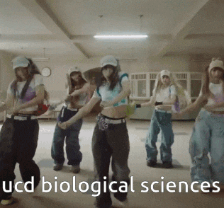 a group of young women are dancing in a room with the words ucd biological sciences written on the bottom
