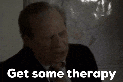 a man in a suit says get some therapy in front of a map