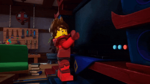 a lego character with a v on his chest is standing in a dark room