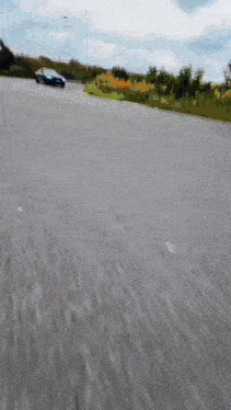 a car is driving down a road in a blurred image