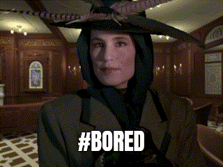 a woman wearing a hooded jacket and a hat with the hashtag #bored