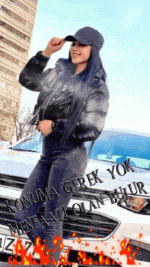 a woman standing in front of a car with the words " konuma gerek yok " written on the front