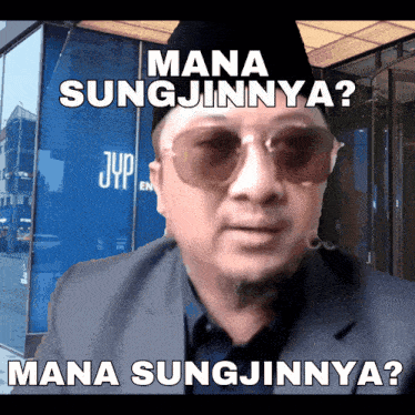 a man wearing sunglasses and a hat says mana sungjinnya mana sungjinnya