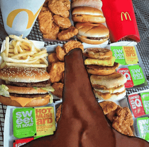 a bunch of fast food including a mcdonald 's cup