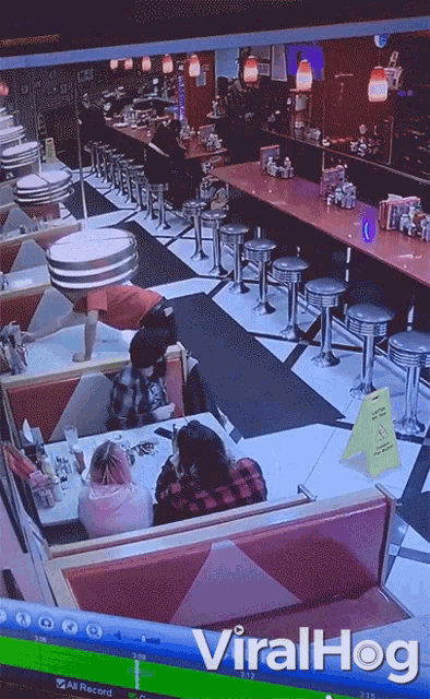 a screen shot of a diner with the words viralhog at the top