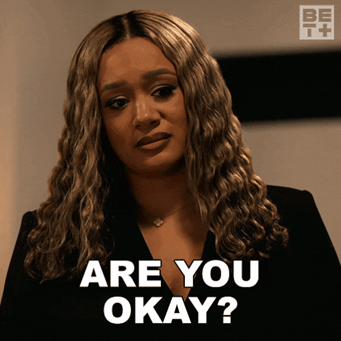 a woman says are you okay in a black shirt