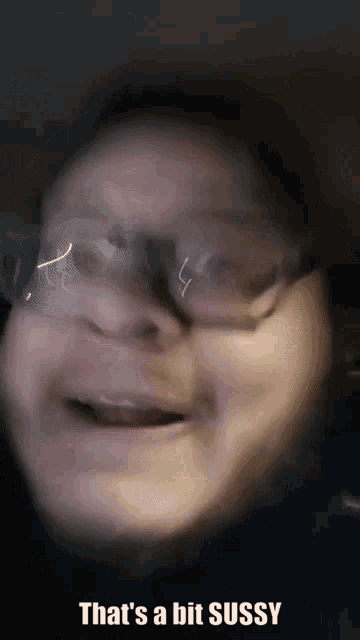 a close up of a person 's face with the words that 's a bit sussy