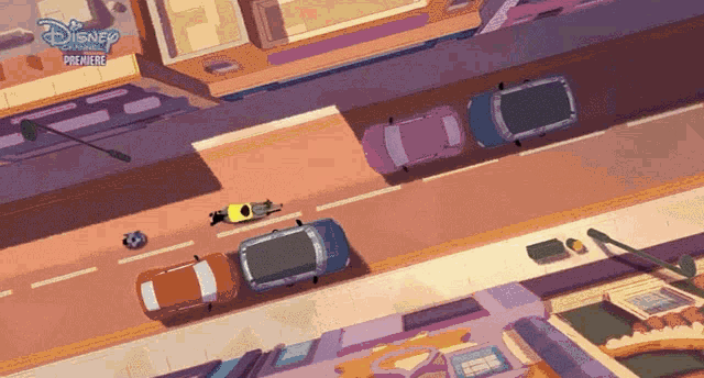an aerial view of cars driving down a street with a disney premiere logo in the corner