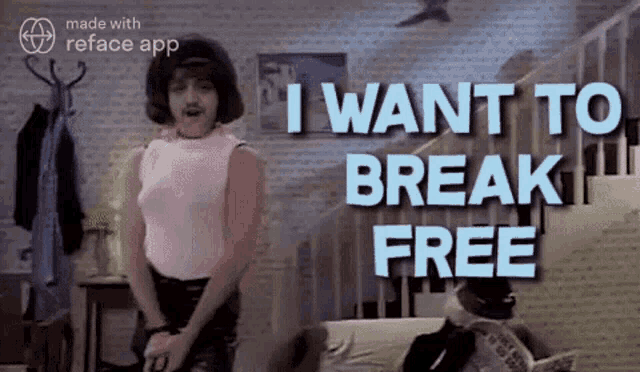a man in a pink shirt is standing in front of a wall that says i want to break free