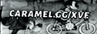 a black and white photo of mickey mouse riding a bicycle with the words caramel.cc/xve written on it