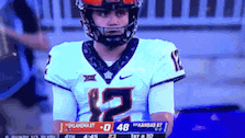 a football player wearing a number 12 jersey
