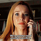 a woman talking on a cell phone with the words we 're gonna need another sacrifice