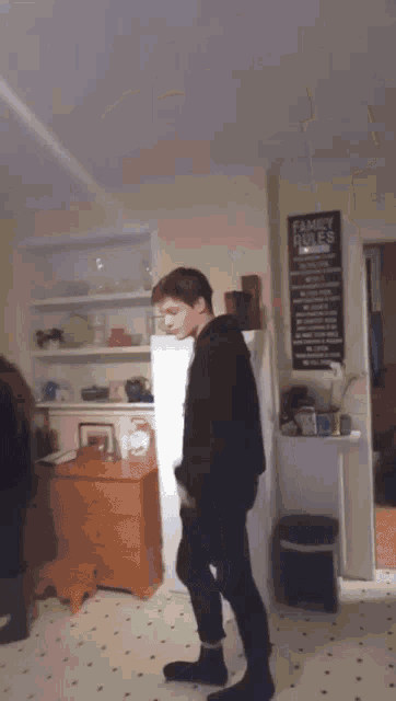 a blurry picture of people dancing in a room .