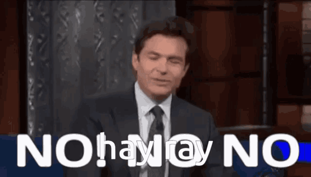 a man in a suit and tie says no hay