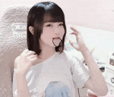 a girl is sitting in a chair with the word one on the back of it