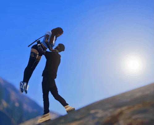 a man is carrying a woman in the air with the sun shining in the background