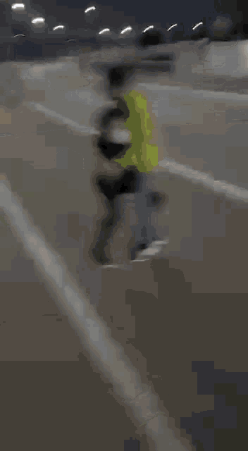 a blurry picture of a person carrying another person on a stretcher .