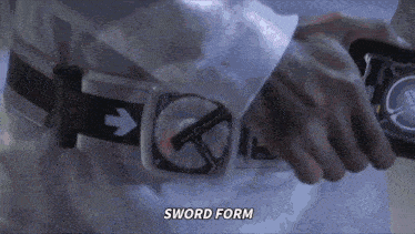 a person wearing a belt with an arrow pointing to the right and the word sword form below it
