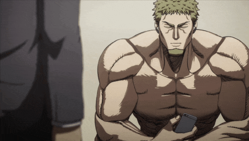 a shirtless man is holding a cell phone