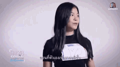 a girl in a black shirt with the number 1925 on her chest