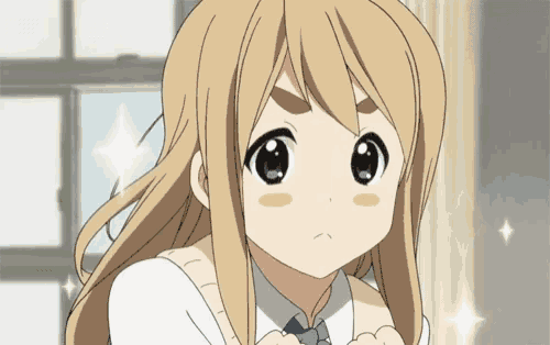 a girl with long blonde hair and a blue tie