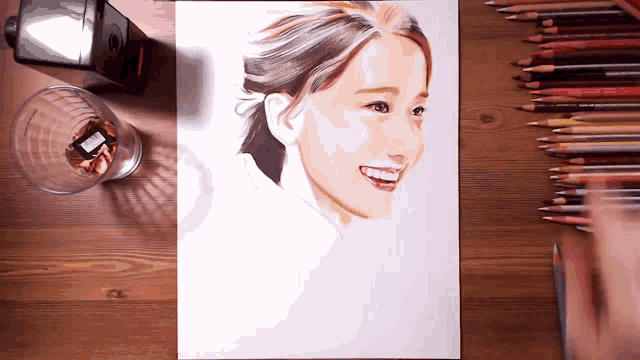a drawing of a woman with colored pencils and a sharpener