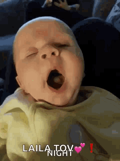 a baby yawning with the words " laila toy " written on the bottom