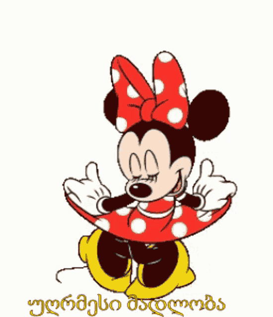 a cartoon of minnie mouse wearing a red and white polka dot dress giving a thumbs up